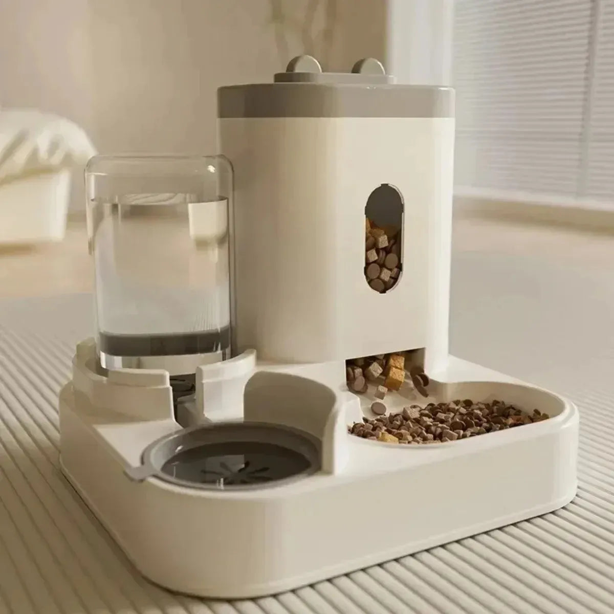 Comedero automático para mascotas con dispensador de agua y comida seca, ideal para perros y gatos en casa